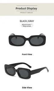 Close-up of retro rectangular sunglasses with thick black frames and dark gray lenses