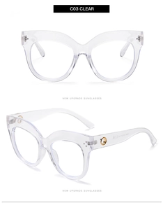 Detail of transparent cat-eye frames featuring silver studs and golden temple accents