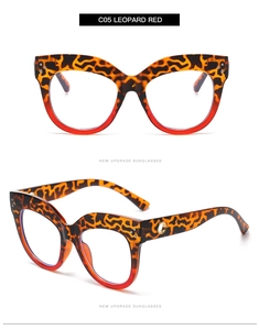 Detail of cat-eye frames in leopard and red gradient with gold metal ring accents