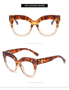 Detail of leopard brown cat-eye glasses frame with golden hollow ring hinge design