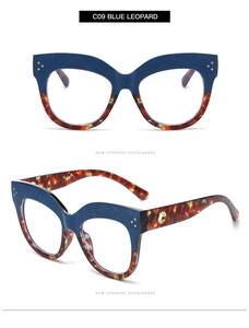 Detail of blue and leopard print cat eye sunglasses with gold hollow ring on temple