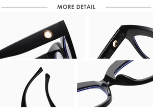 Macro detail of black oversized cat-eye frames with golden ring decor and sturdy hinges