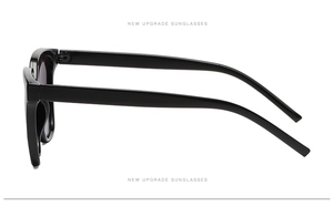 Side view detail of sleek black square sunglasses with streamlined temples and dark lenses