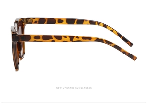 Side view of leopard print sunglasses featuring dark polarized lenses and hinge details