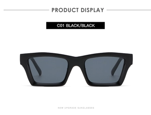 Detailed view of the all-black rectangular sunglasses featuring a sleek polished finish
