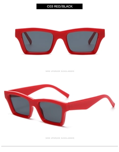 Detail view of bold red square frame sunglasses with dark lenses in a retro trendy style