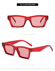 Detail view of square clear red Y2K sunglasses with transparent frames and matching lenses
