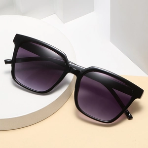 Square black frame oversized sunglasses with purple gradient lenses on geometric stand