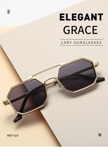 Close-up of polygon metal frame sunglasses with gradient lenses on geometric backdrop