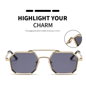 Close-up of golden metal hinge and double bridge on polygon punk style sunglasses