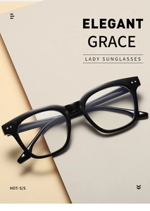 Detail of square black acetate glasses frame with silver rivets on beige background