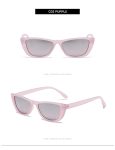 Detail view of purple transparent cat-eye sunglasses with grey lenses and slim temples