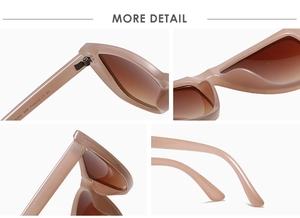 Detail of pink cat eye sunglasses with metal hinges, integrated nose pads and brown lenses
