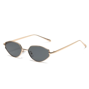 Lunettes de soleil œil de chat rétro avec monture dorée et verres hexagonaux gris chic