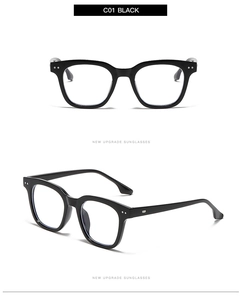 Close-up of square black frame glasses with silver dot detail and C01 model text