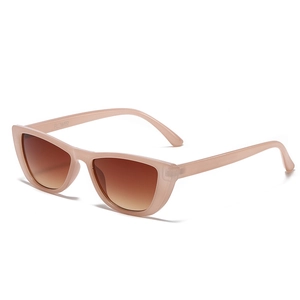 Stylish cat eye sunglasses in transparent pink frame with brown gradient lenses
