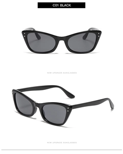 Detail view of retro cat eye sunglasses featuring thick black frames and silver rivets