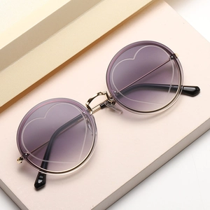 Chic gold metal round rimless sunglasses with purple gradient lenses and heart patterns