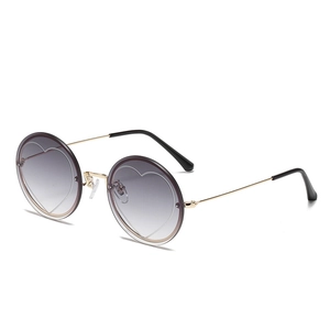 Round rimless sunglasses with heart pattern gradient lenses and gold metal frame
