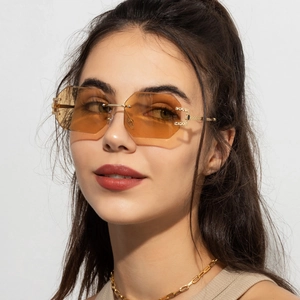 Fashion rimless sunglasses with gradient orange octagonal lenses and gold metal temples