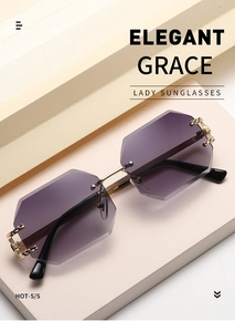 Detail of rimless geometric sunglasses with purple gradient lenses and gold metal temples