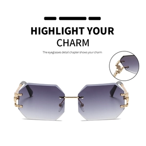 Detail view of rimless octagonal sunglasses with purple gradient lenses and gold hinges