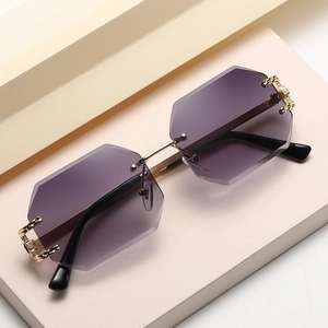 Frameless polygonal sunglasses with gradient purple lenses and gold metal temples
