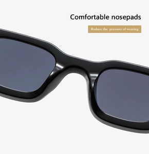 Detail of square black sunglasses showing comfortable integrated nose pads design
