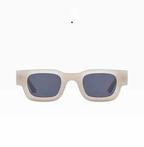 Detail view of square frame sunglasses in jelly grey with dark lenses for hip-hop style