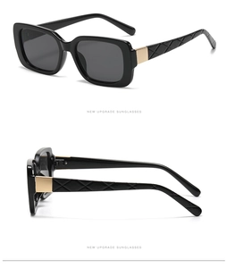 Detail view of retro rectangle sunglasses featuring quilted temples and gold metal accents