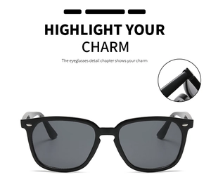 Detail view of glossy black Wellington sunglasses frame with silver metal rivets