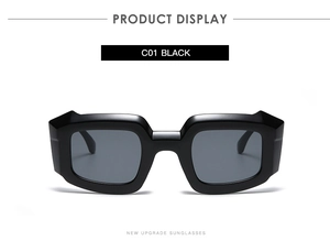 Detail view of bold black geometric square sunglasses with dark grey lenses and thick frame