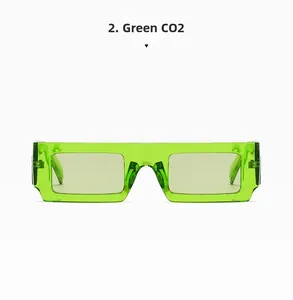 Close-up of translucent light green rectangular sunglasses in a modern flat frame design