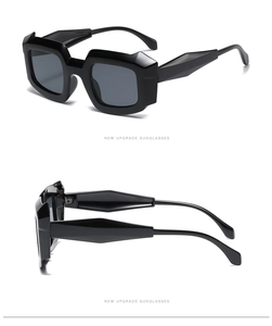 Detailed view of futuristic polygonal thick-frame sunglasses with faceted 3D edges