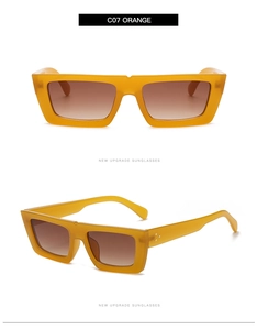 Vue détaillée de lunettes de soleil ovales oranges avec verres dégradés marron
