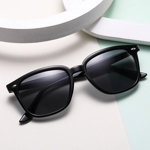 Classic black square frame sunglasses for women with vintage silver rivets and dark lenses