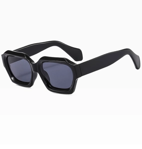 Detail view of bold black geometric hexagonal frames on modern fashion sunglasses