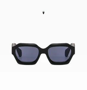 Detail view of matt black polygon sunglasses frame with dark grey lenses in style C02
