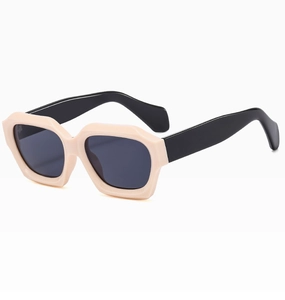 Detail of cream geometric frames with black temples on modern fashion sunglasses