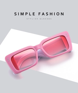 Macro detail of rectangle pink frames with gradient lenses and silver rivet accents