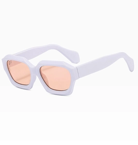Detailed side view of thick white resin sunglasses frames with tinted orange lenses