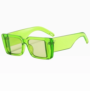 Detailed side view of oversized neon green square frame sunglasses with thick temples