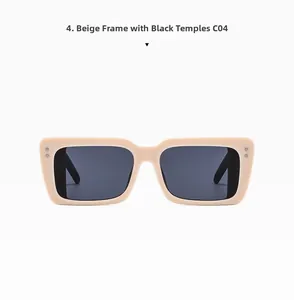 Detail view of large beige frame sunglasses with black temples and dark grey lenses