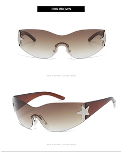 Detail of brown gradient lenses and silver star metal hinge on vintage sunglasses