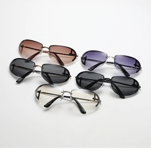 Top view of Y2K oval sunglasses in brown, purple, and gray with sleek metal temples