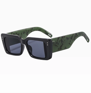 Detail of square sunglasses with black frame, green marble temples and silver rivets