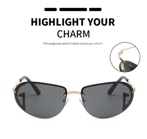 Detail of pilot sunglasses with gold metal bridge and iconic G letter logo on lenses