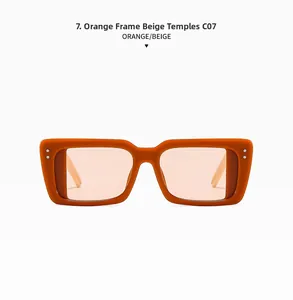 Detail of square orange frame sunglasses with beige temples and silver rivet accents