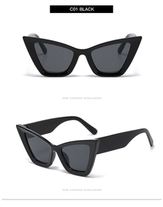Détail de lunettes de soleil œil de chat noires avec verres gris et monture chic