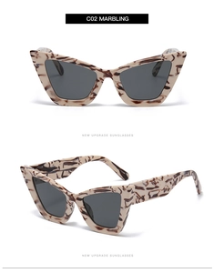 Détail des lunettes de soleil œil-de-chat C02 marbrées avec verres gris et monture